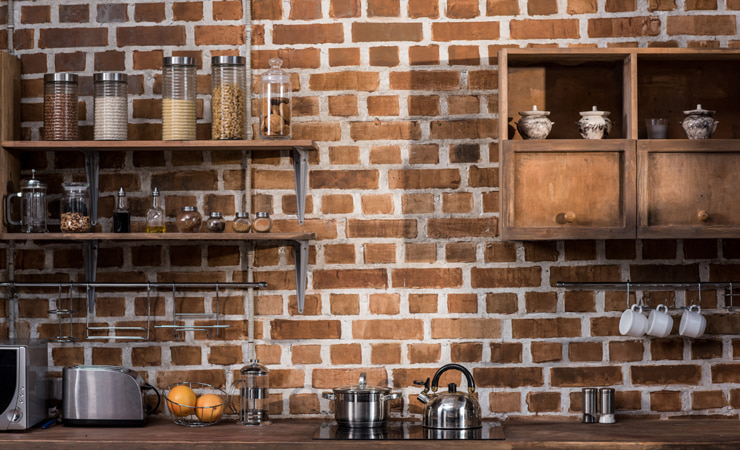 Rustic kitchen with open shelves and upper cabinetry.